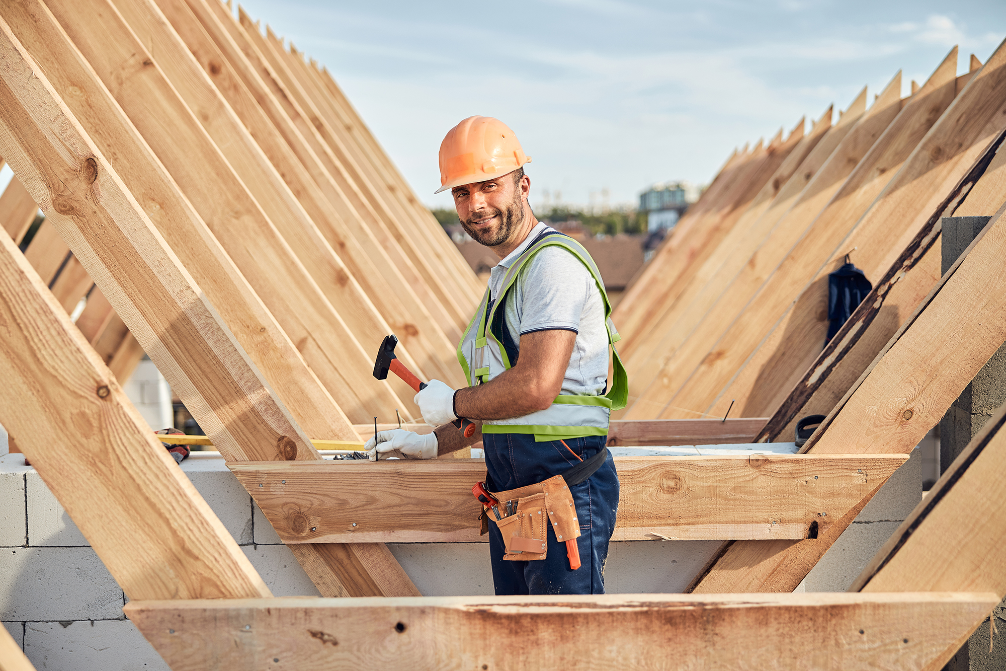 Roofer constructing new roof trusts Roofer constructing new roof trusts